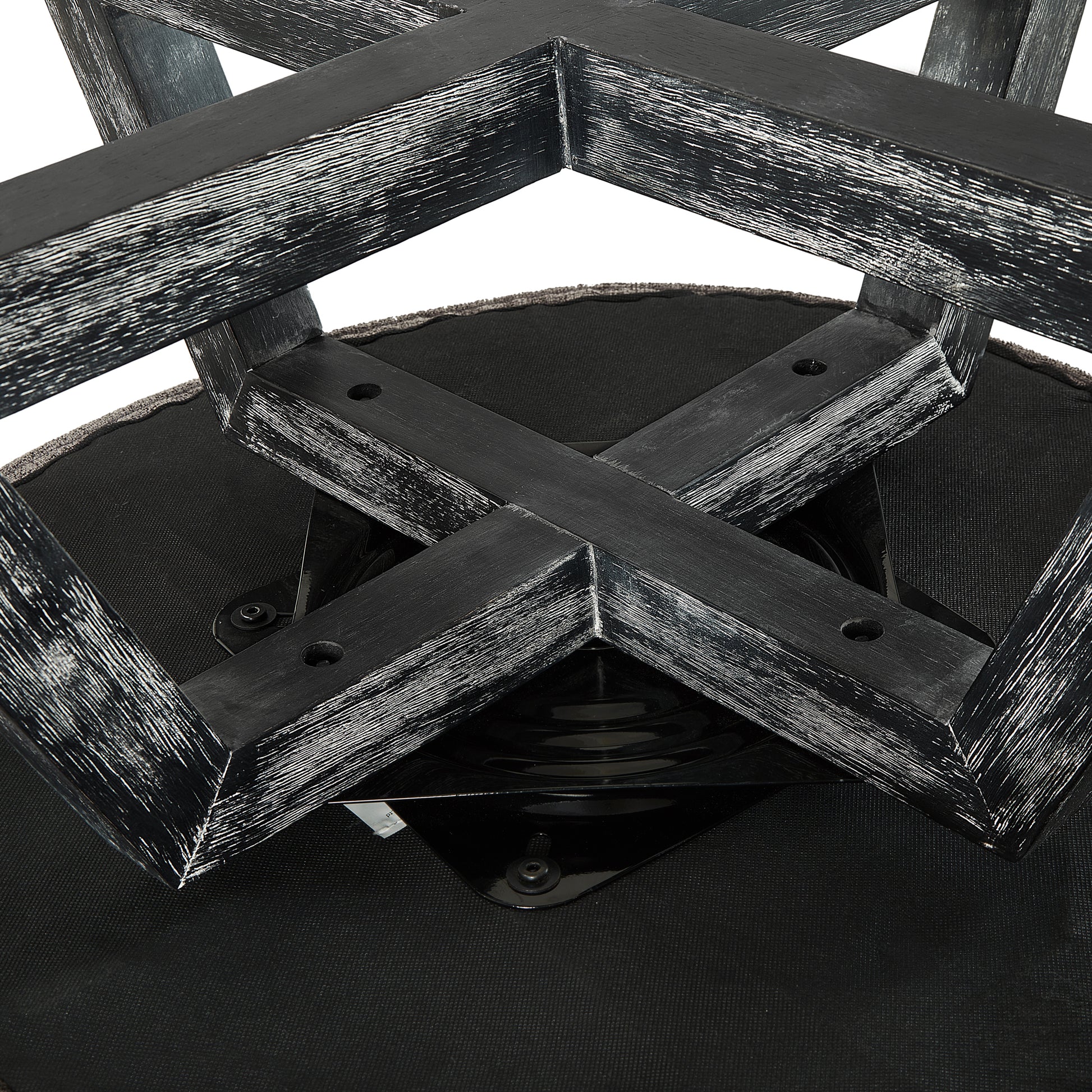 Distressed black wooden bar stool base with upholstered seat detail industrial design