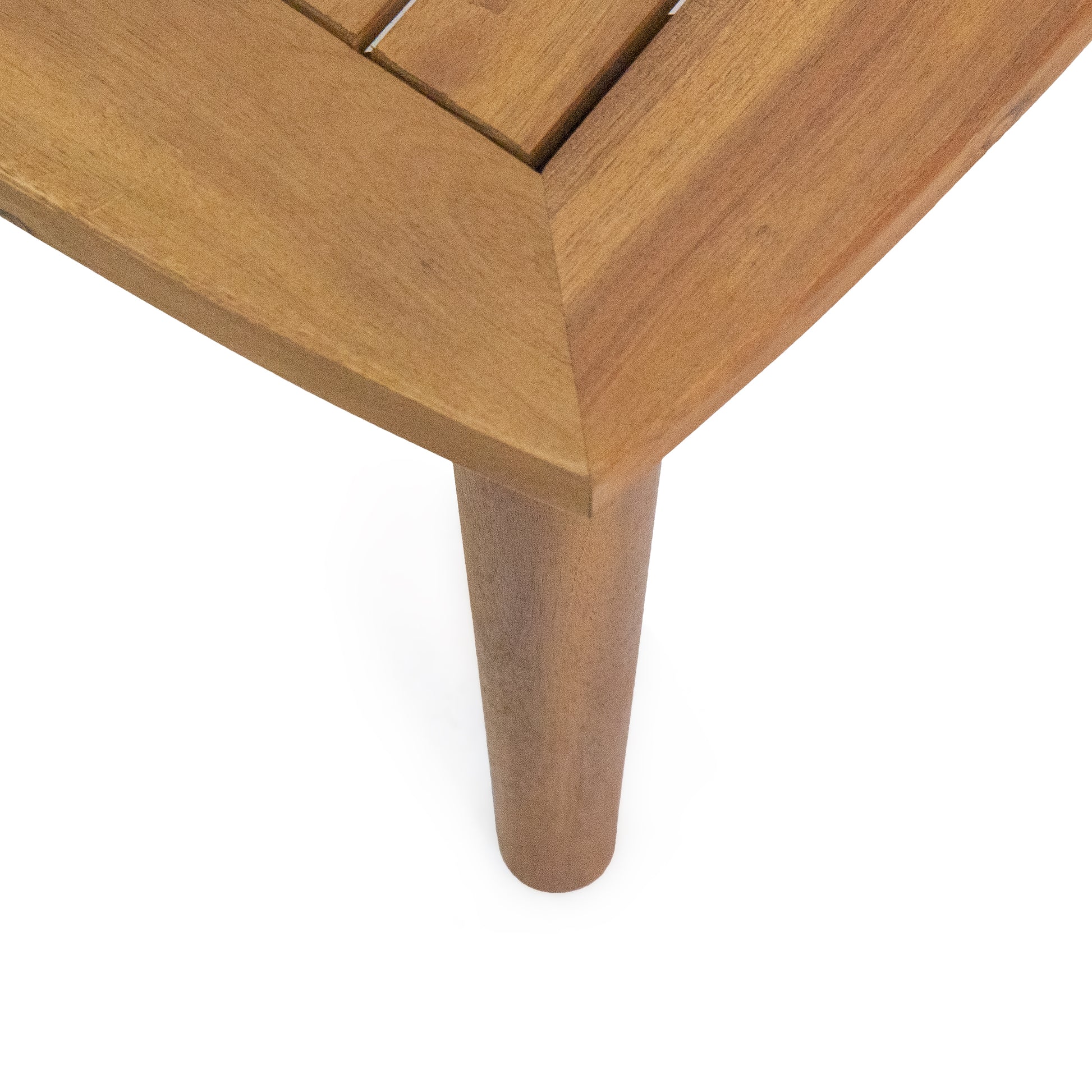 Closeup of a natural wood coffee table top corner with tapered leg