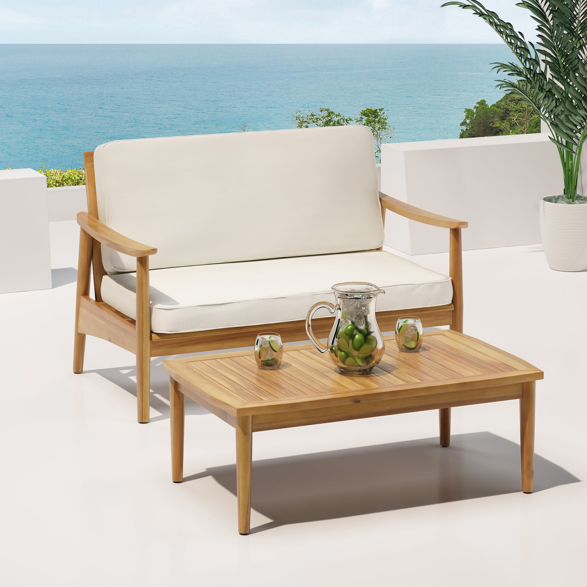 Teak wood patio loveseat with offwhite cushions and a matching coffee table