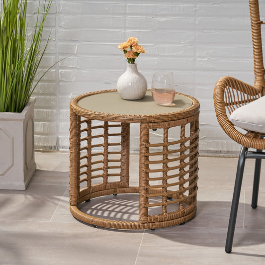Round rattan side table with a beige tempered glass top perfect for patio decor