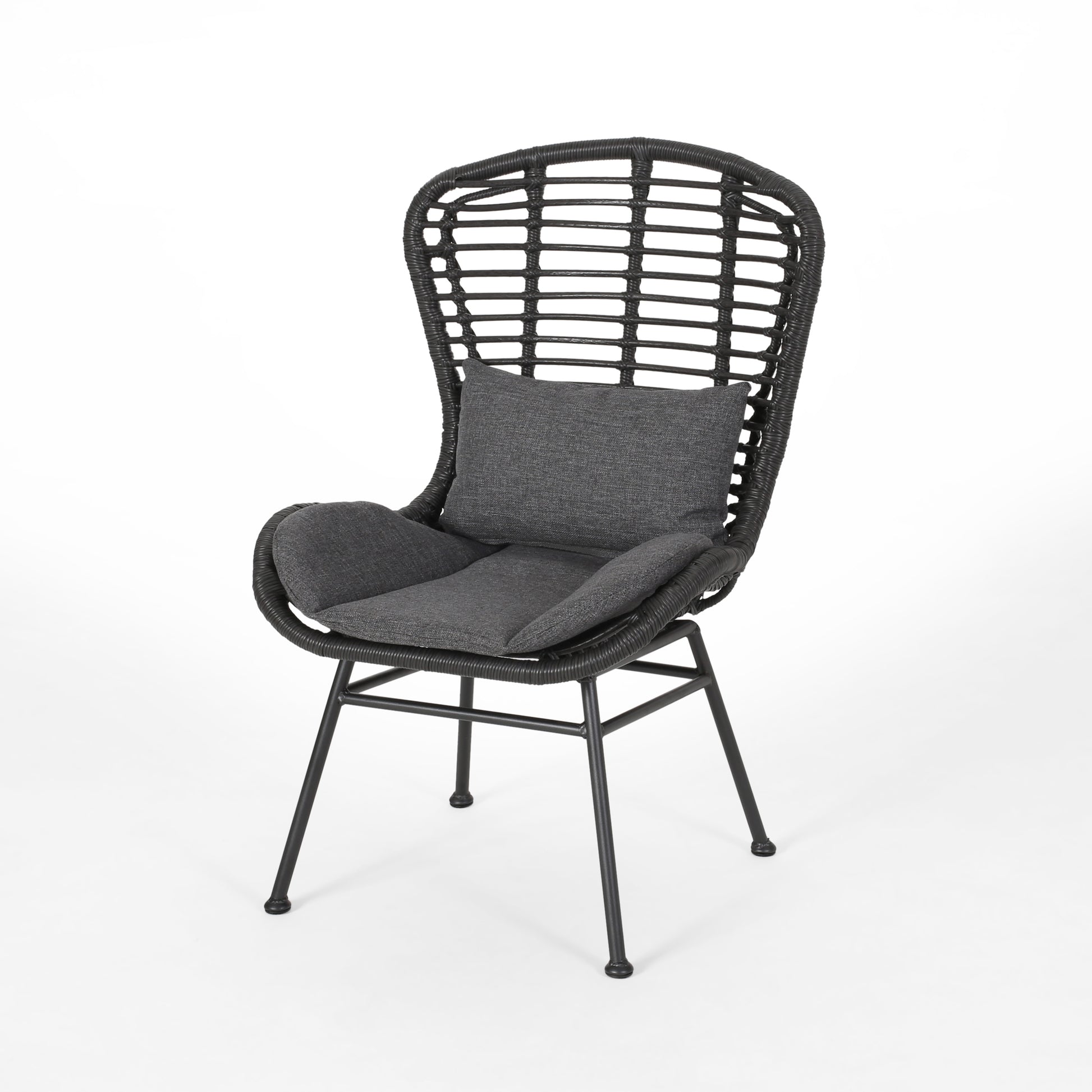 Black wicker chair with dark gray cushions and a high woven back for patio use
