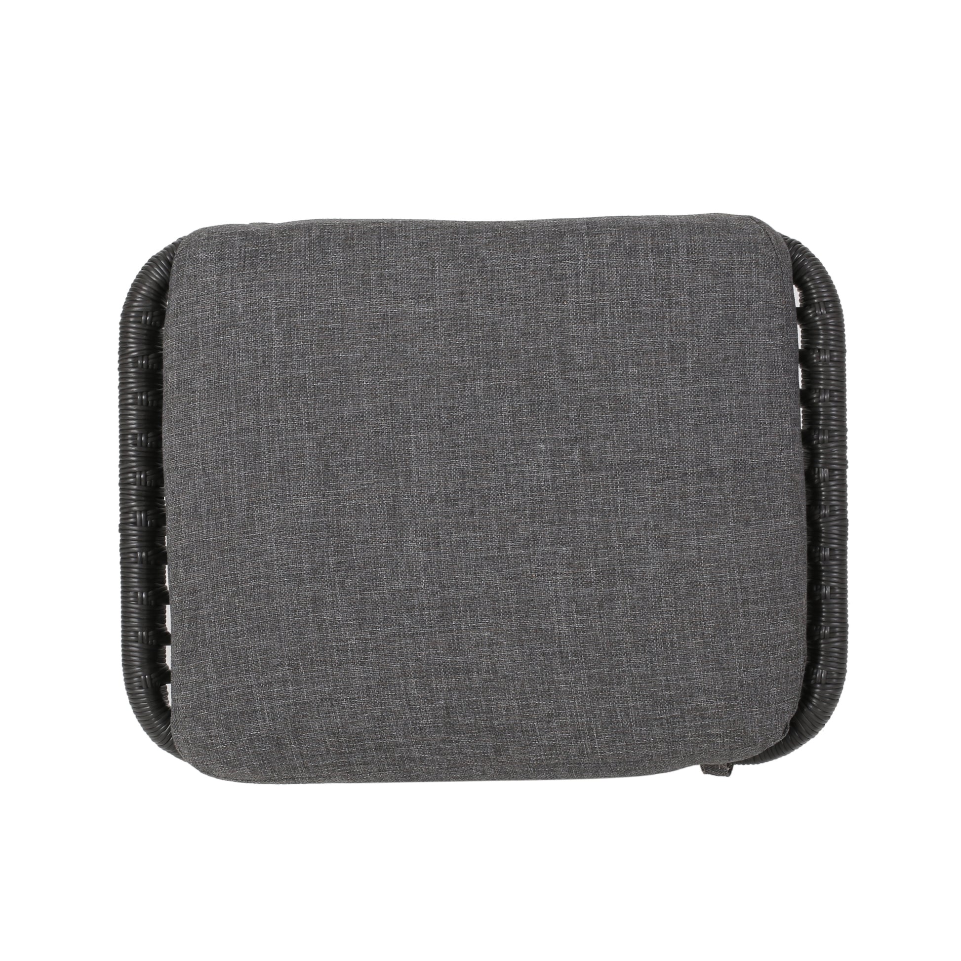Gray upholstered seat cushion with black woven rattan base for outdoor furniture