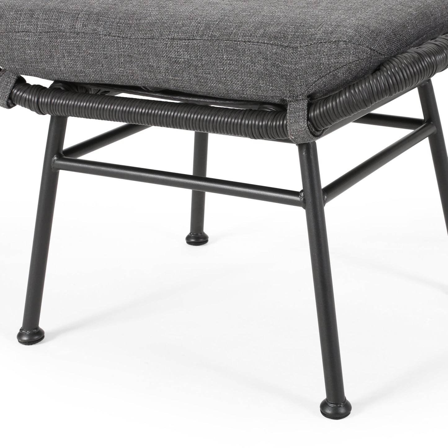 Dark grey upholstered ottoman with black woven rope detail and metal legs
