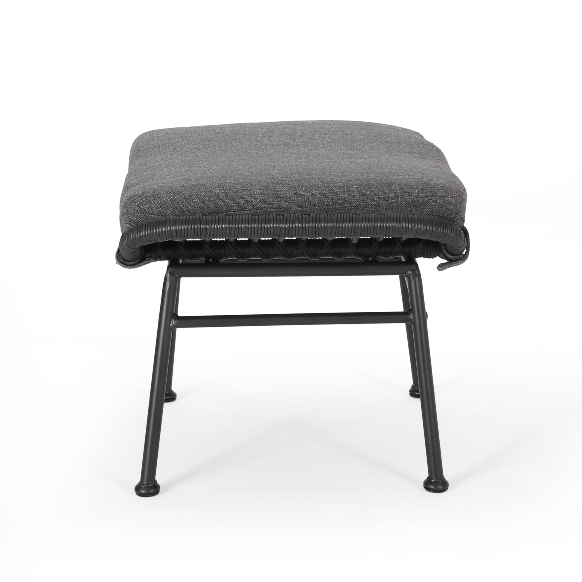 Padded grey fabric ottoman with black rattan weave and metal legs