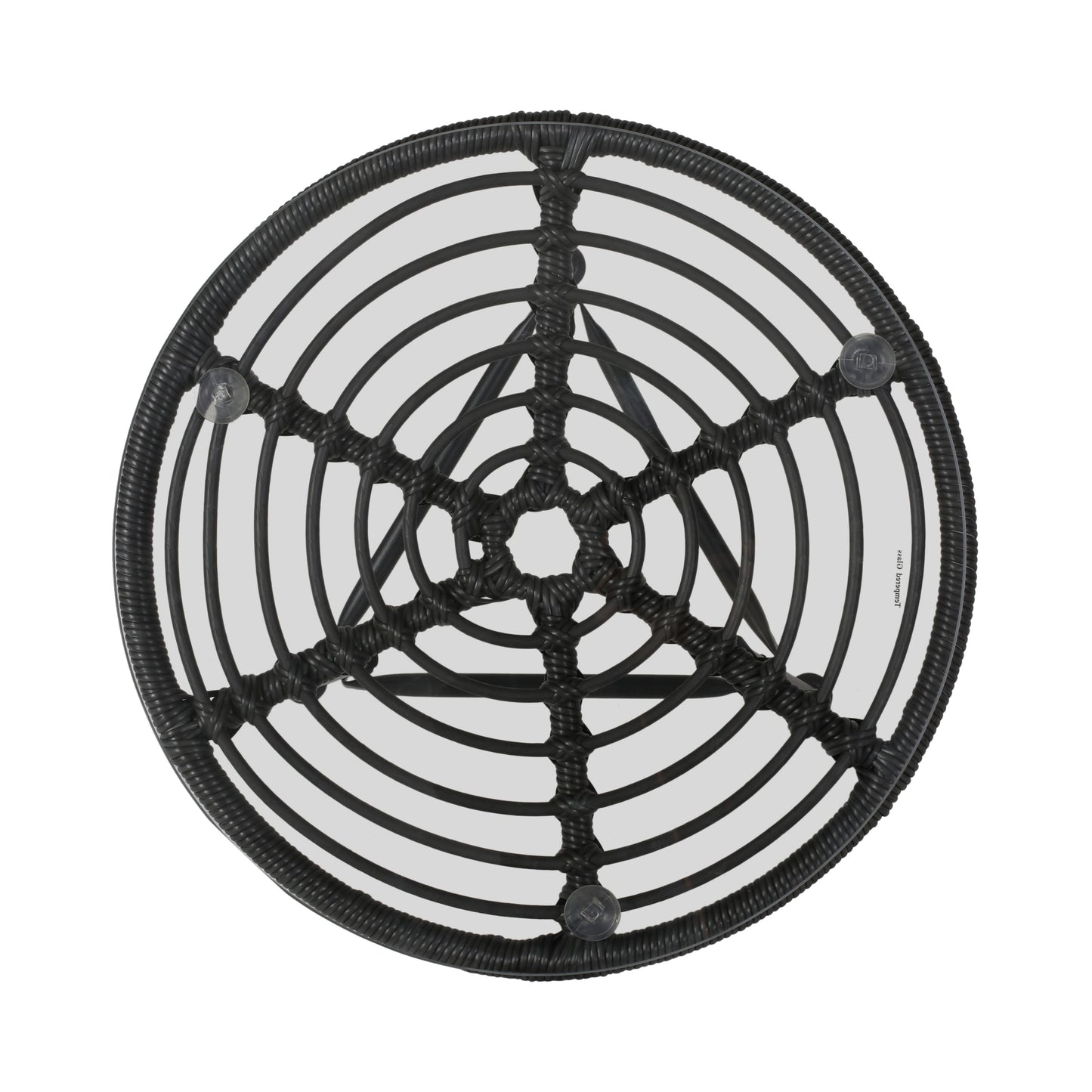 Round black rattan side table with clear glass top and intricate woven detail
