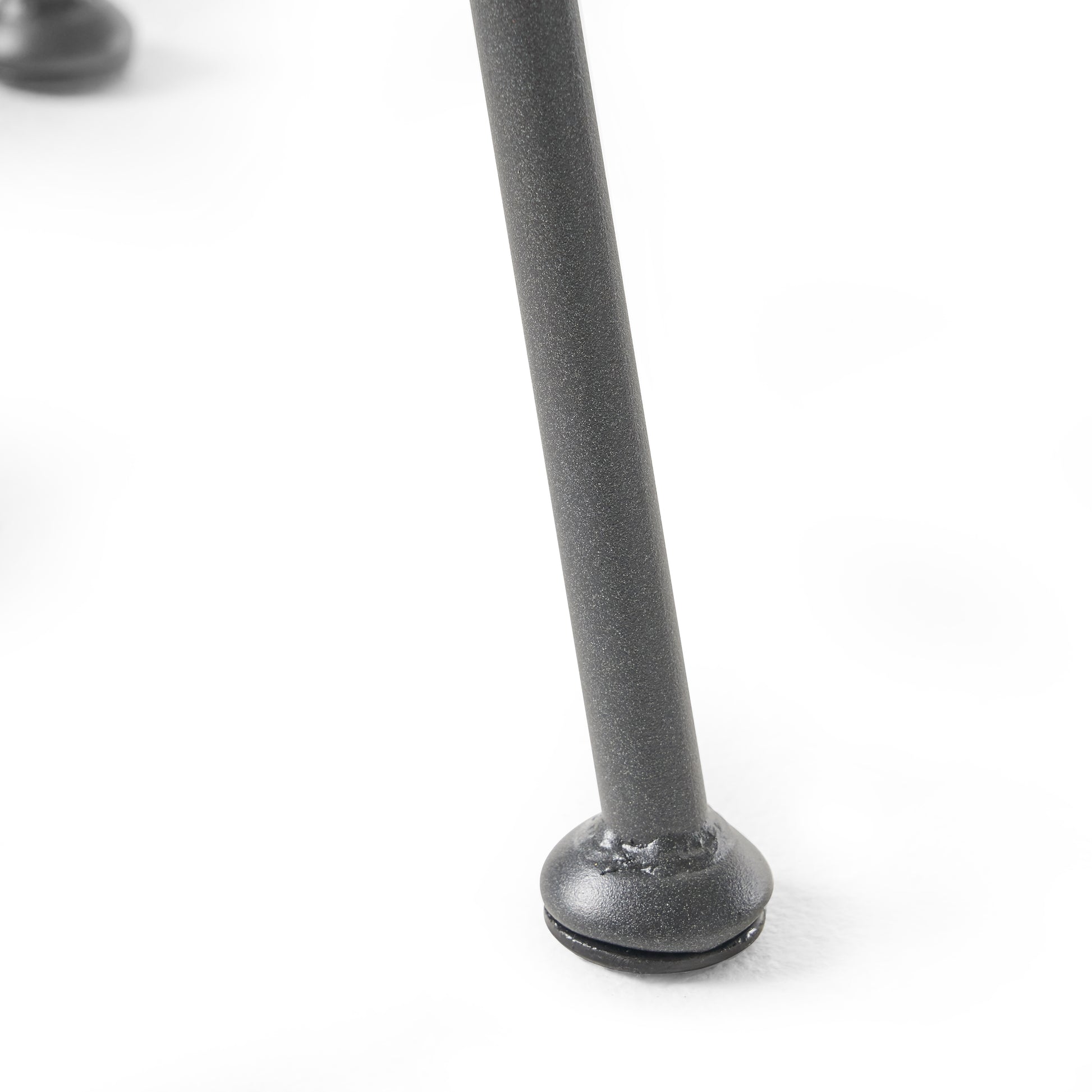 Textured dark gray metal chair leg with black rubber foot