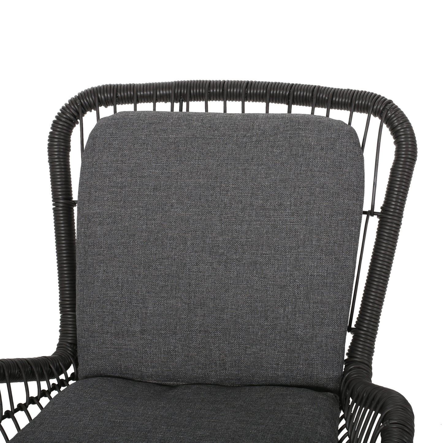 Closeup of a charcoal grey wicker armchair cushion with textured fabric