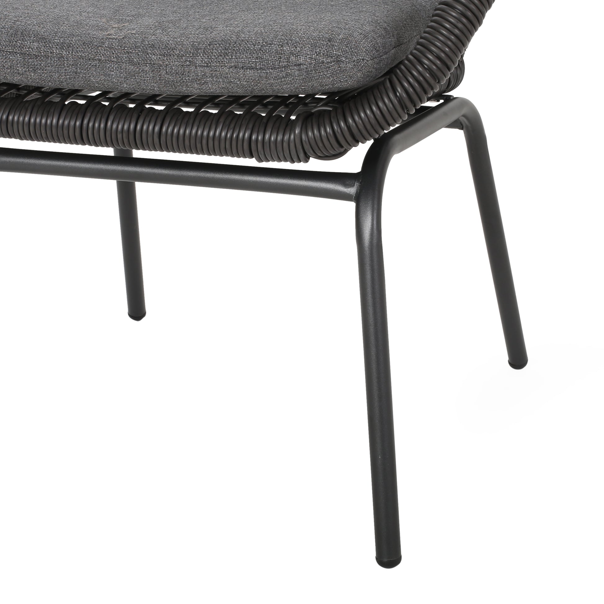 Closeup of a gray woven outdoor chairs metal legs and textured seat cushion showcasing quality craftsmanship
