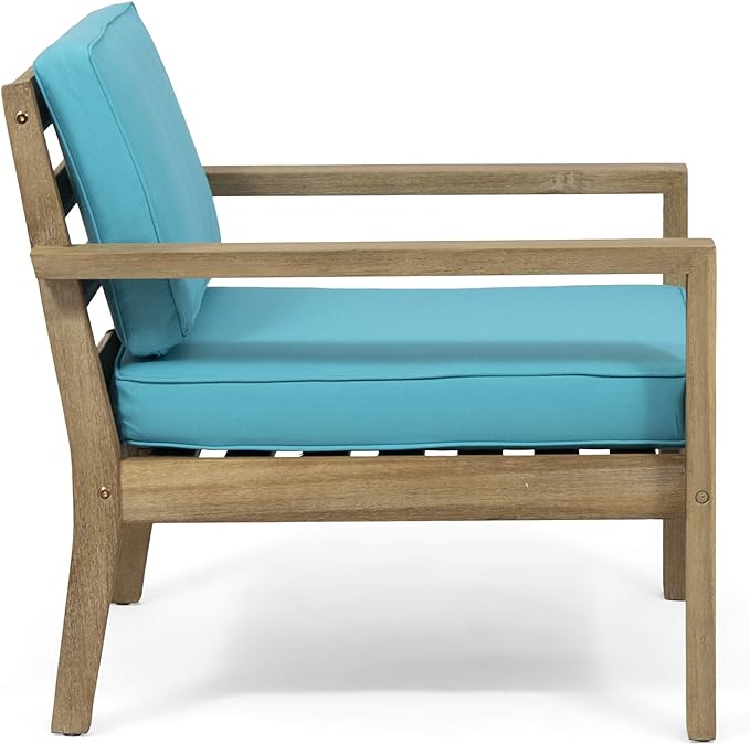 Wooden armchair with bright turquoise cushions perfect for outdoor patio seating