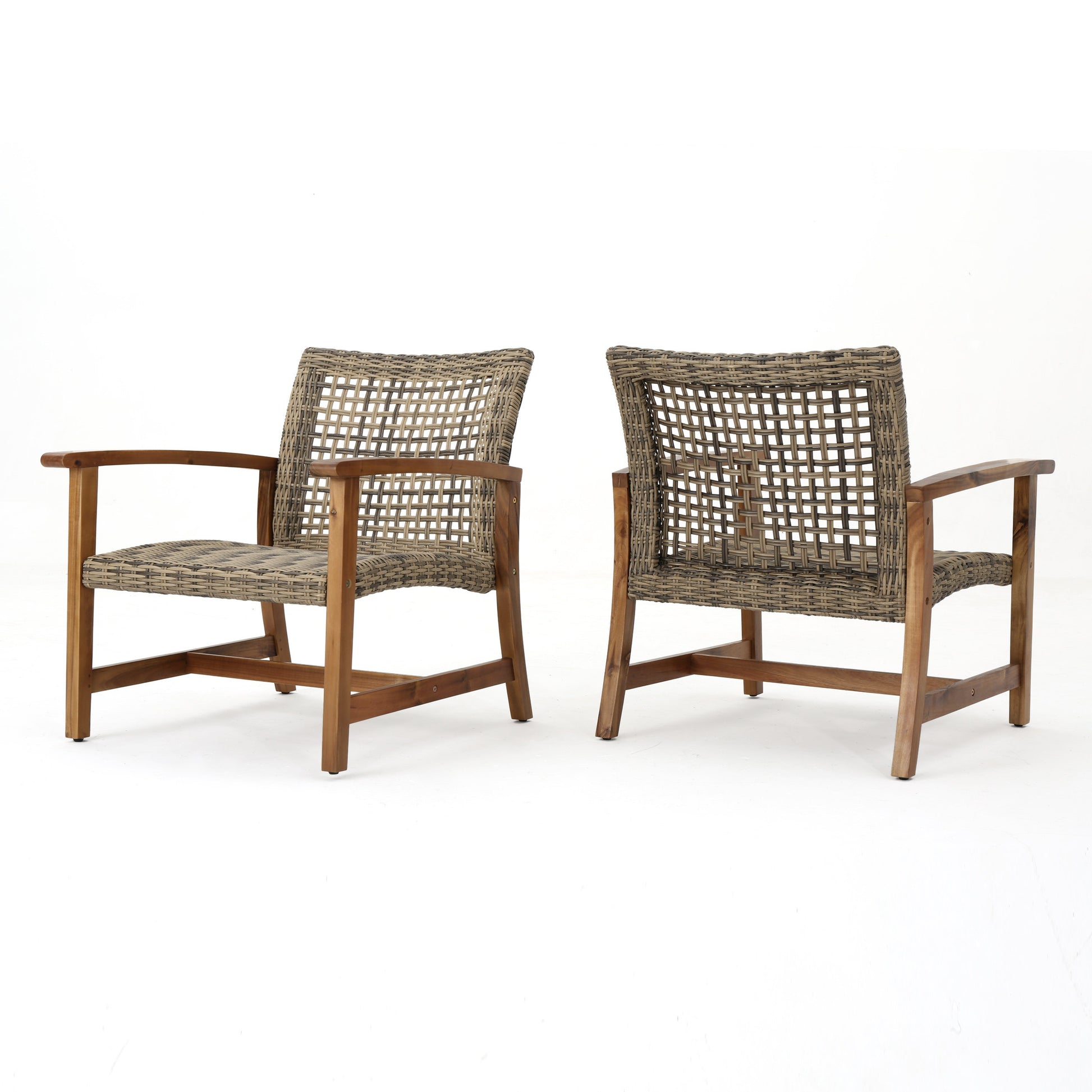 Two woven rattan armchairs with wood frames perfect for outdoor patio seating