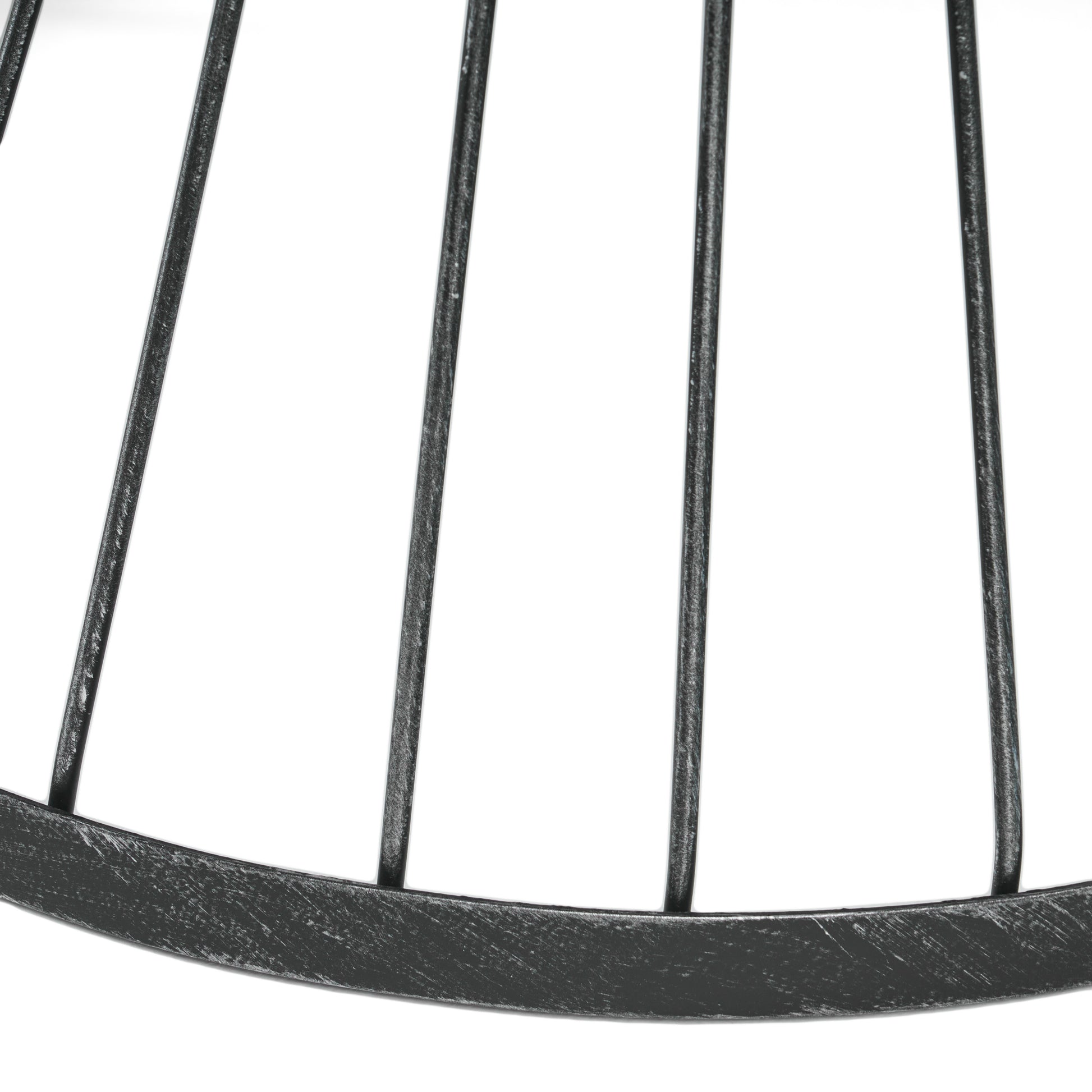 Closeup of a dark metal wire basket rim with vertical bars industrial style