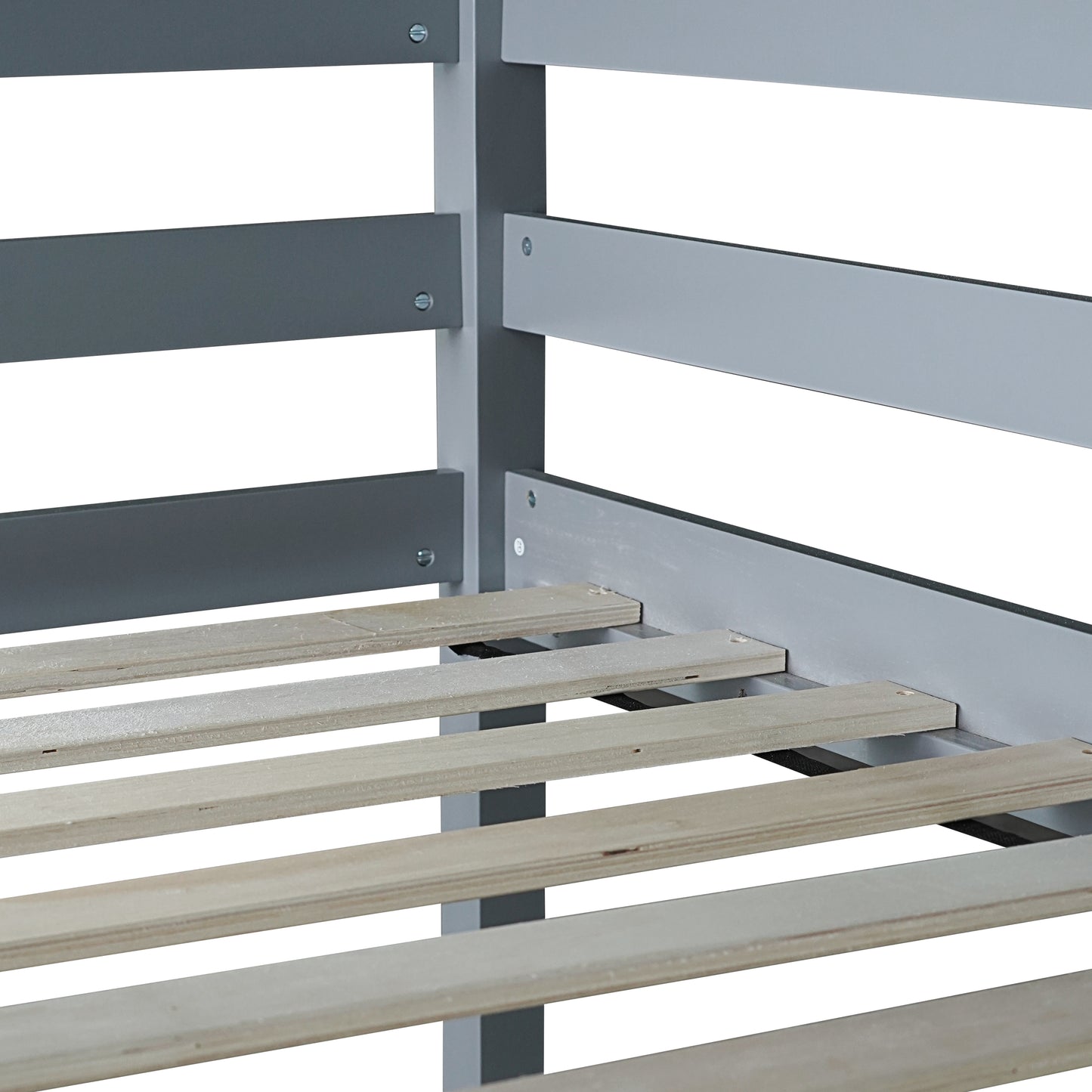 Closeup of grey metal bed frame with wooden slats for mattress support