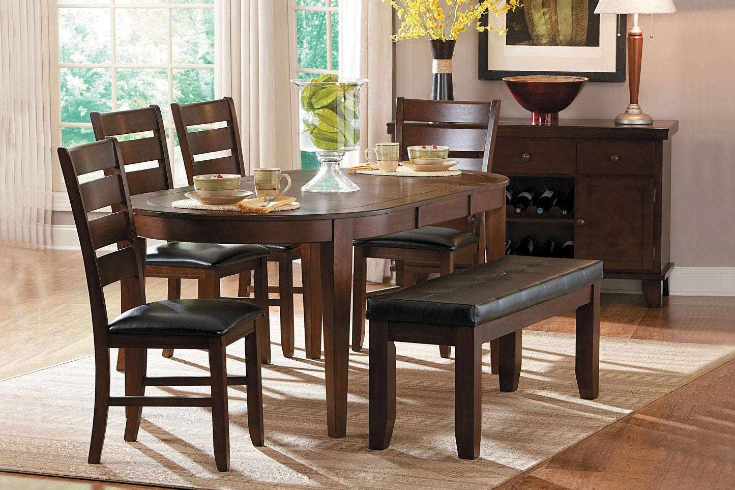 Dark wood dining table with upholstered chairs and bench