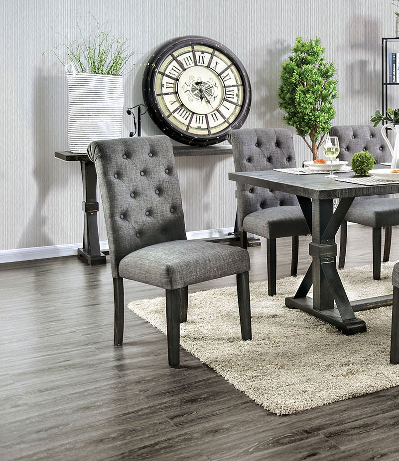 Tufted upholstered dining chair in charcoal gray fabric with dark wooden legs