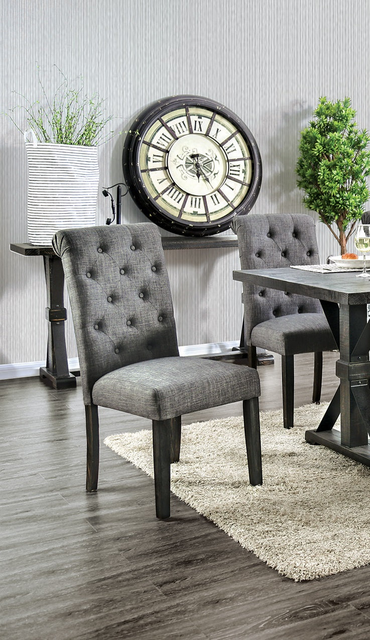 Tufted grey fabric dining chair with dark wood legs and diamond button tufting