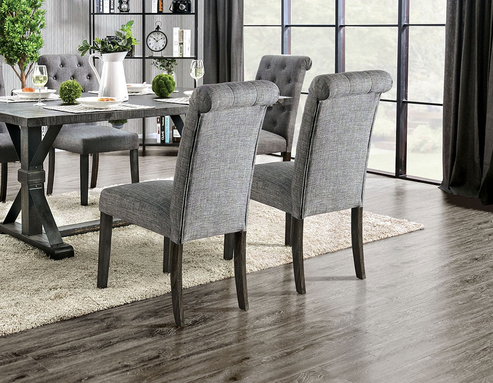 Gray fabric dining chair with rolled backrest and dark wood legs