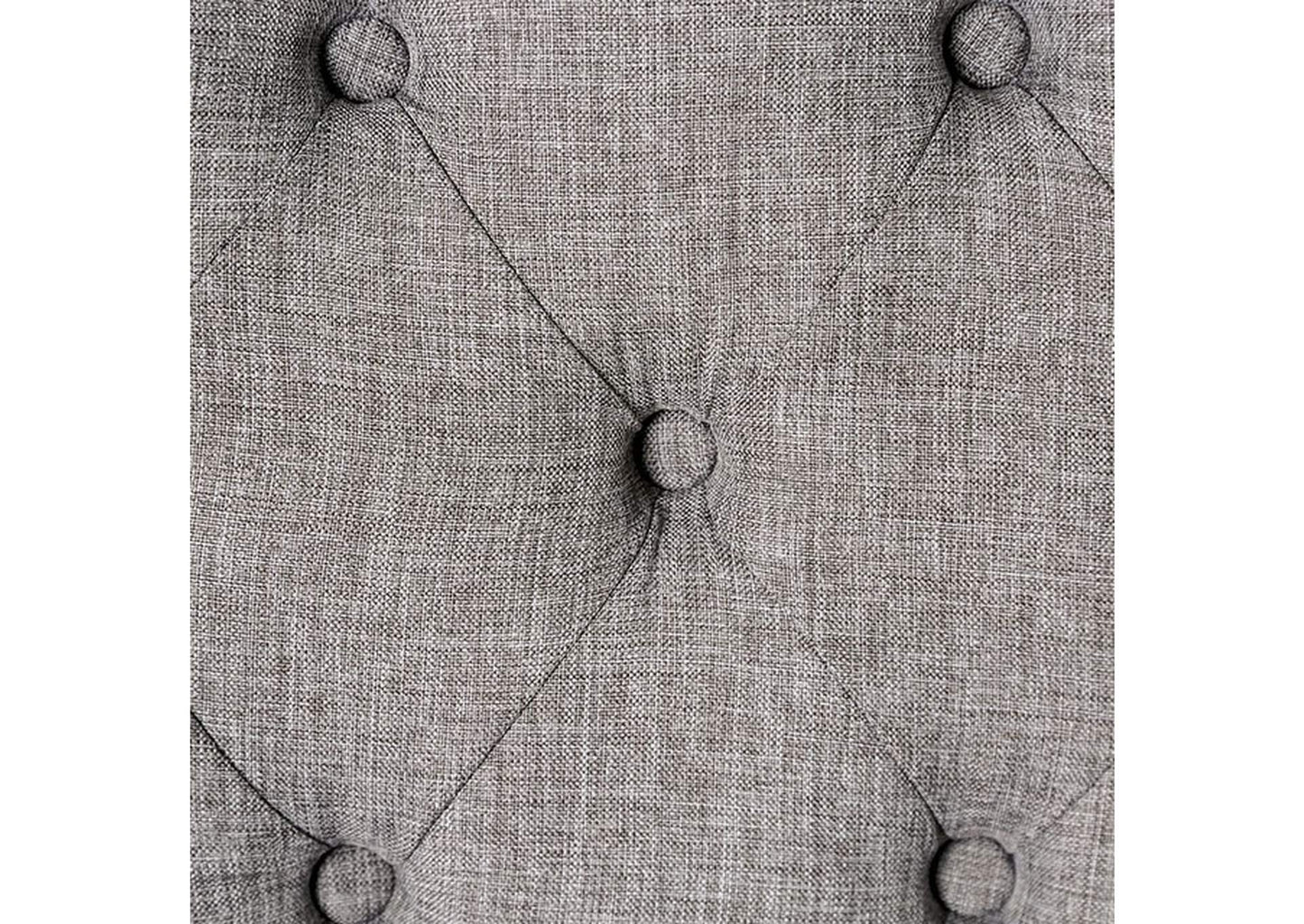 Closeup of grey linen fabric tufted with buttons ideal for upholstery
