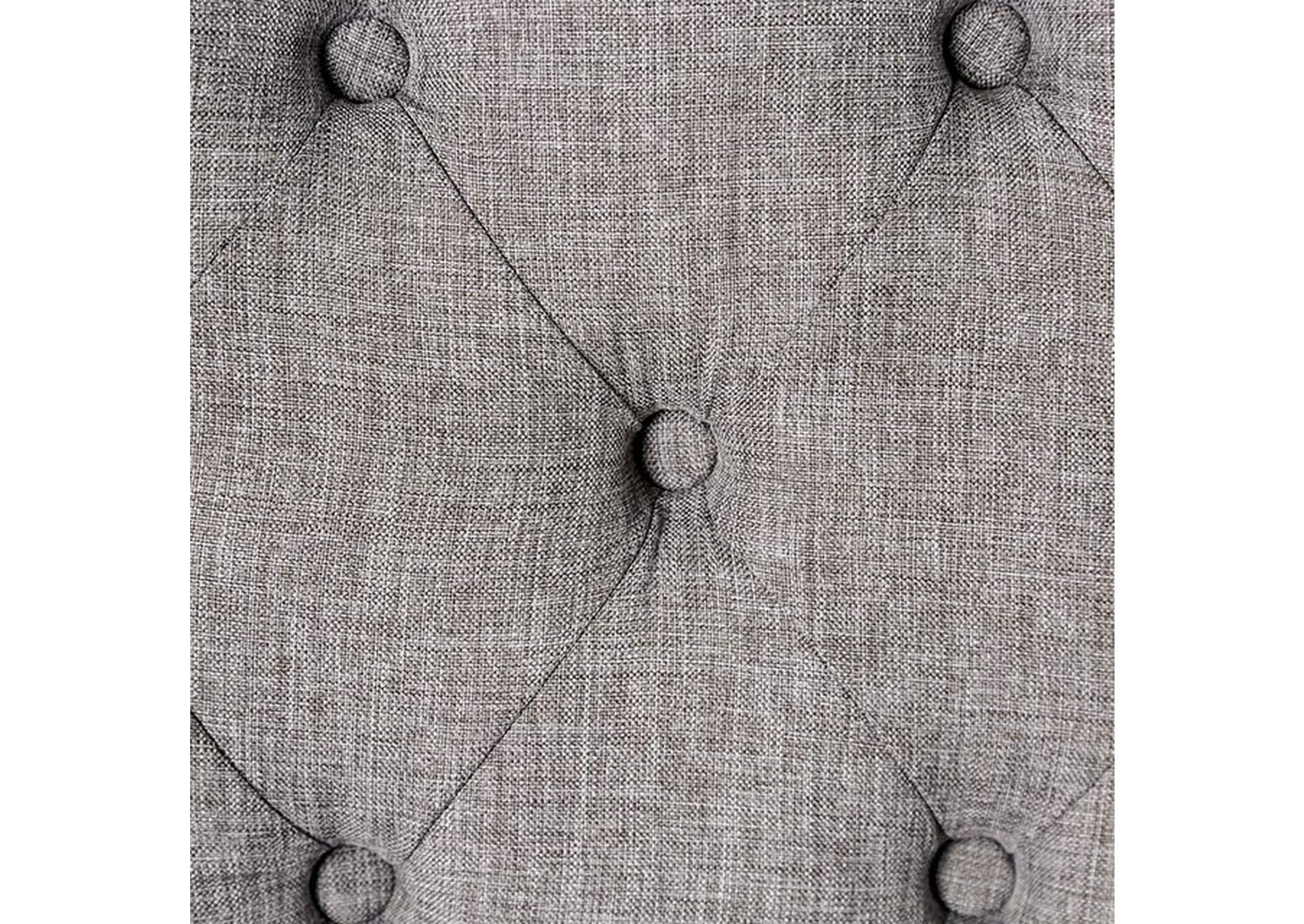 Closeup of grey linen fabric tufted with buttons ideal for upholstery