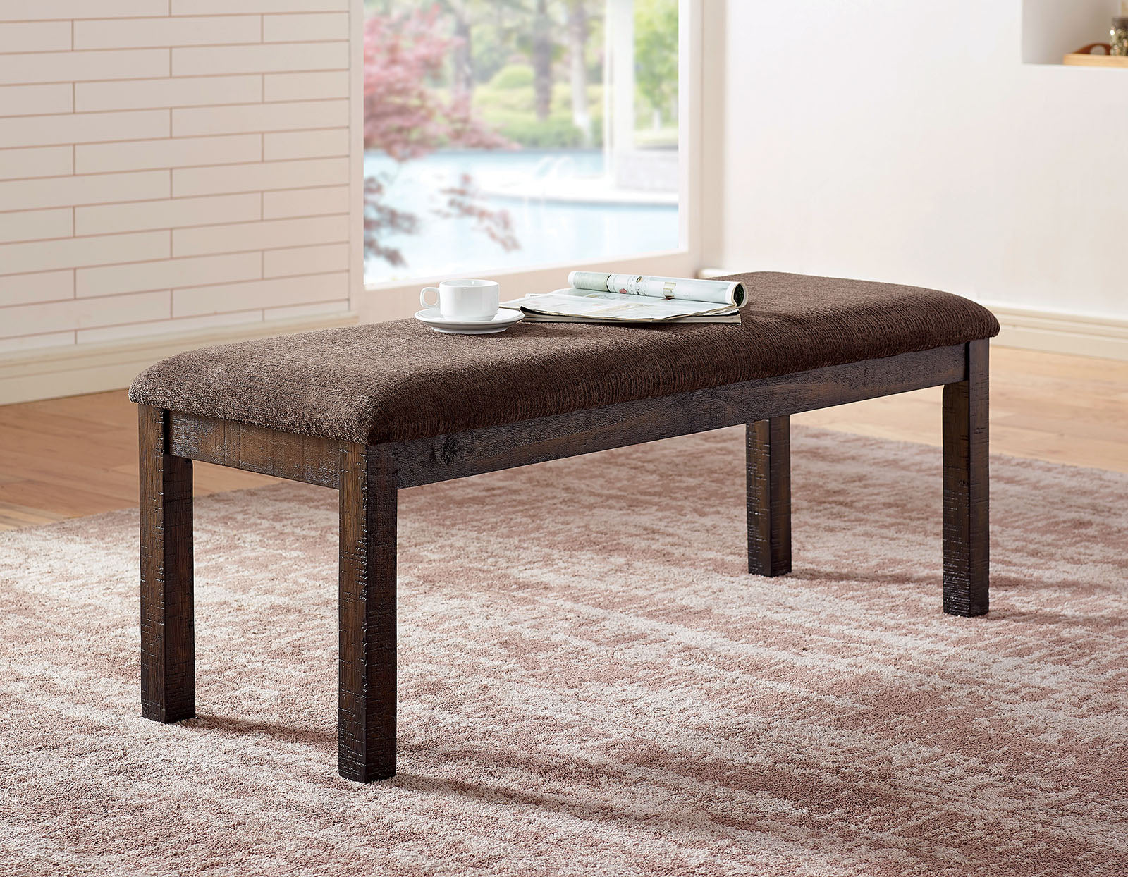 Brown upholstered bench with dark wood legs
