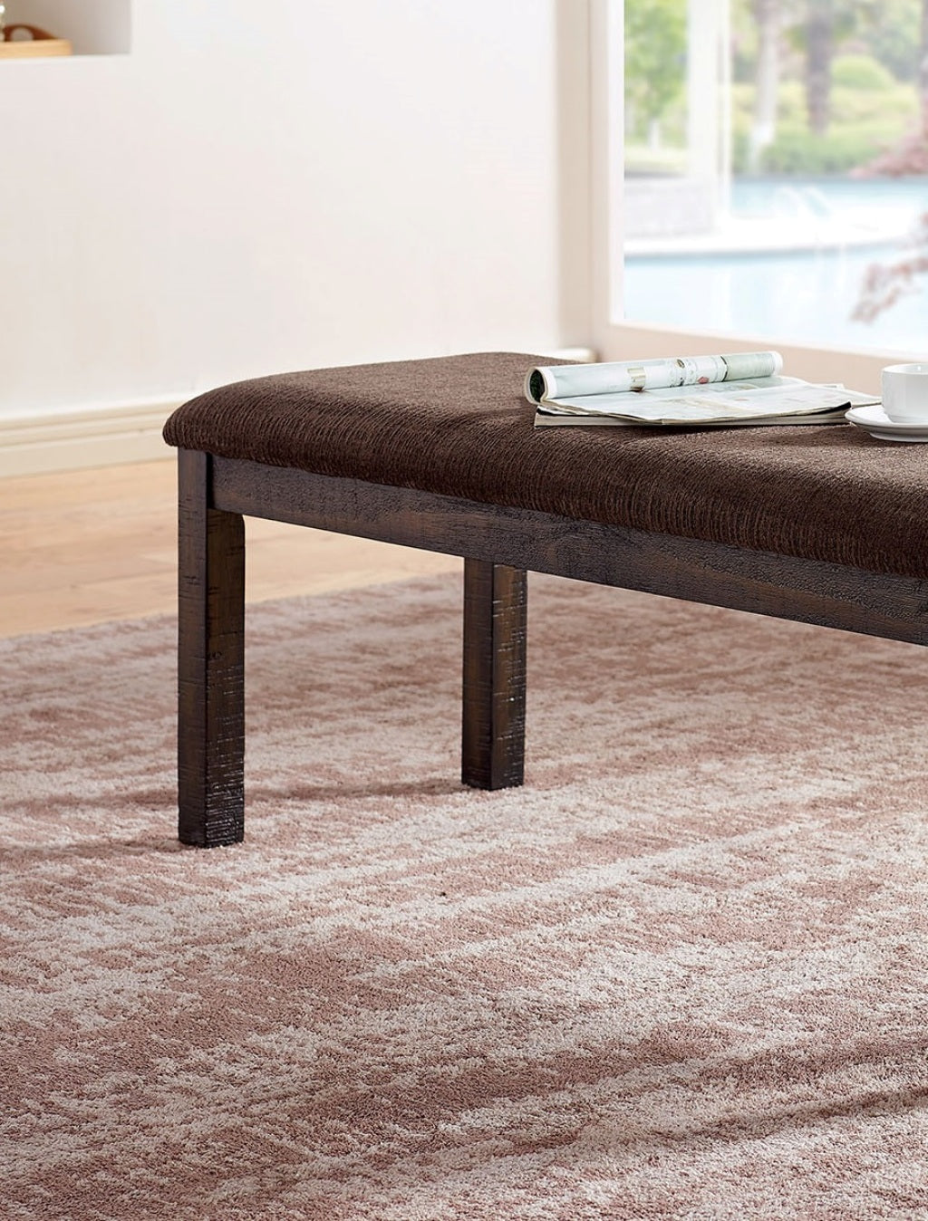 Dark brown fabric upholstered bench with wooden legs