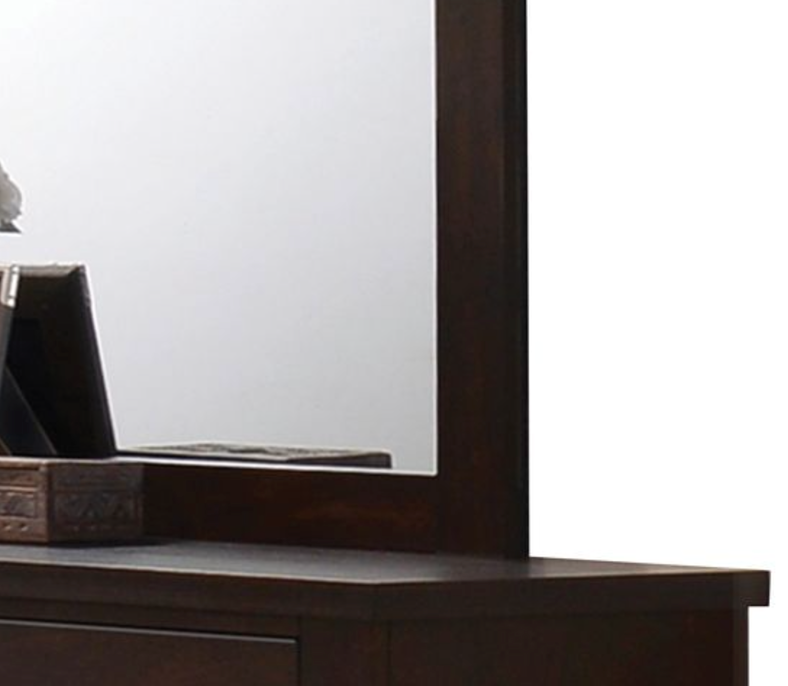 Dark wood vanity mirror with intricate carved drawer