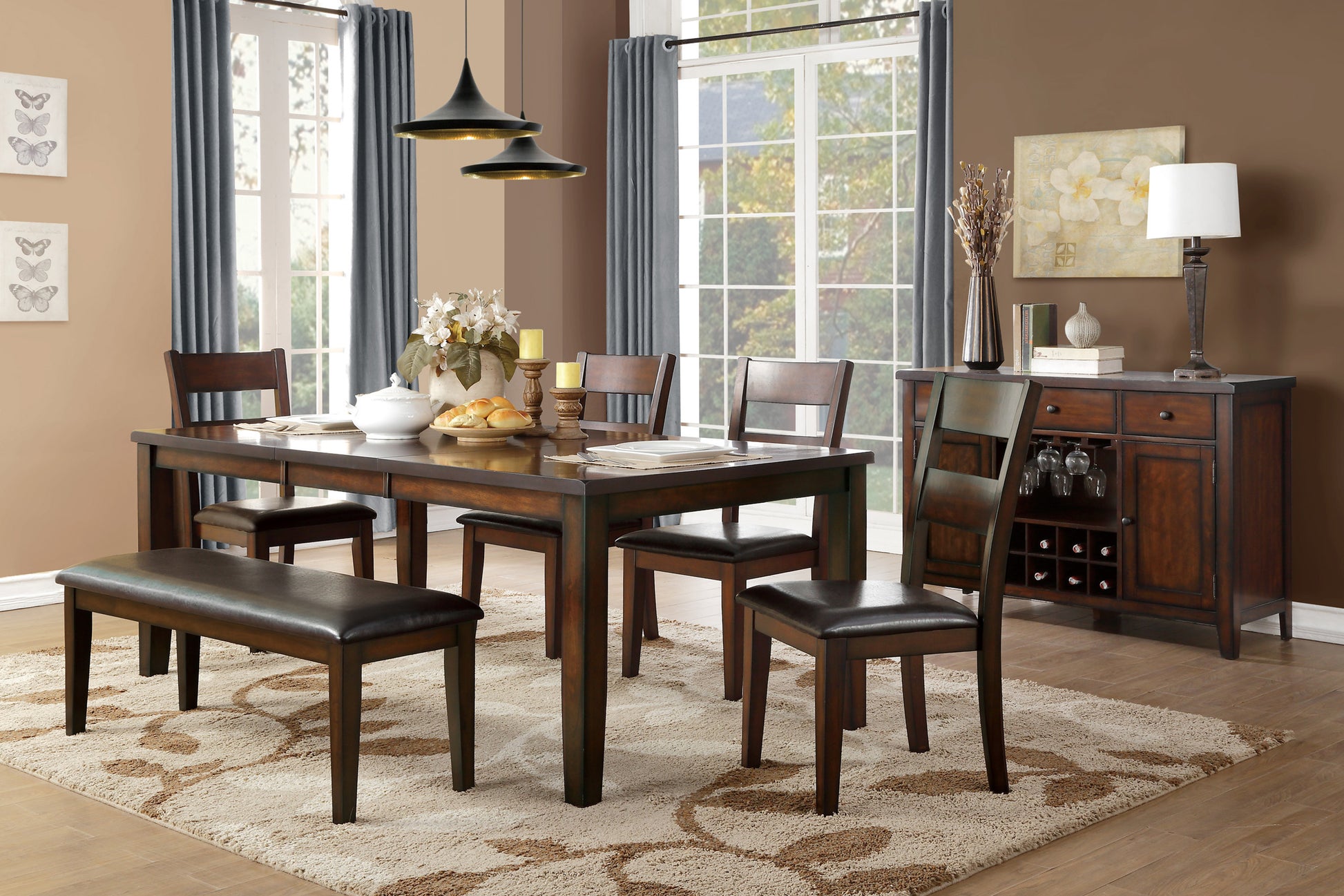 Dark wood dining table with upholstered bench and chairs