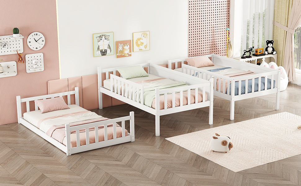 White wooden toddler bed with protective rails and pink bedding