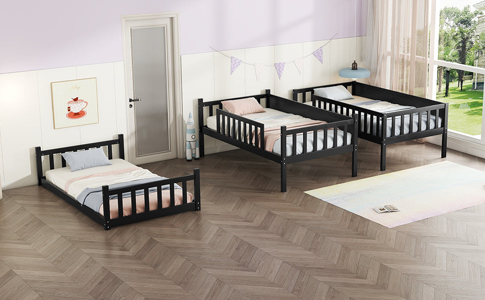 Black wooden toddler bed with rails and light blue pillow