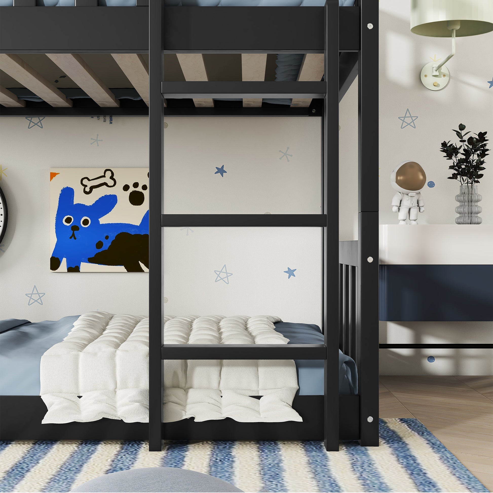 Black metal twin over twin bunk bed with white bedding and blue accents