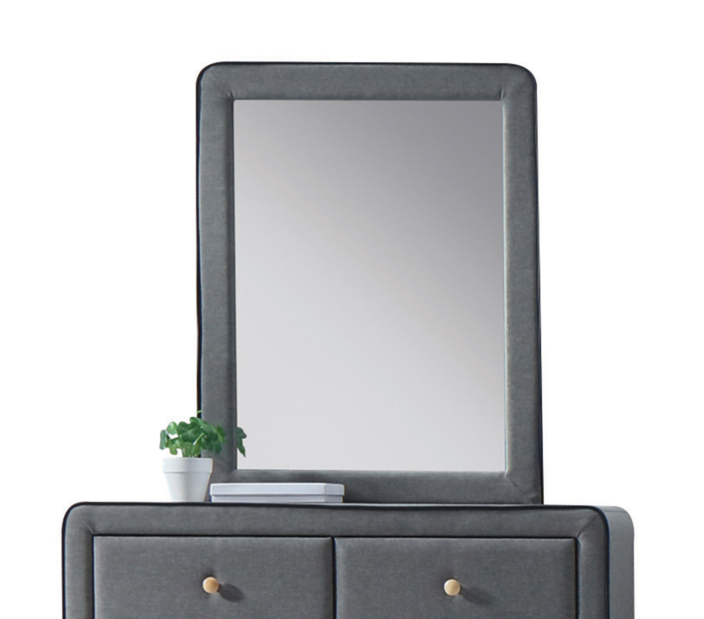 Upholstered gray vanity with mirror and minimalist design featuring two drawers with gold knobs
