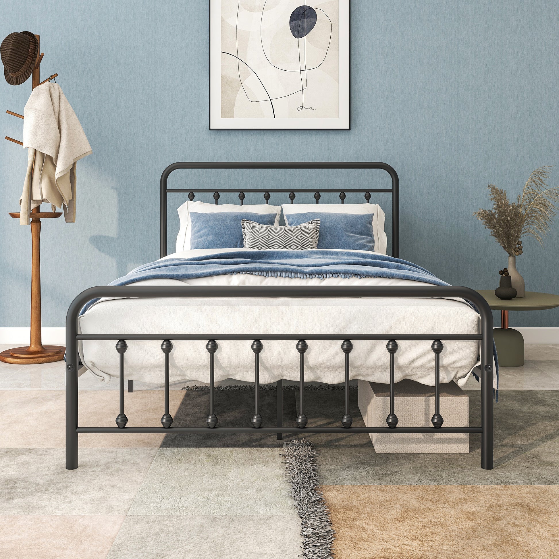 Black metal king size bed frame with ornate finials and upholstered headboard