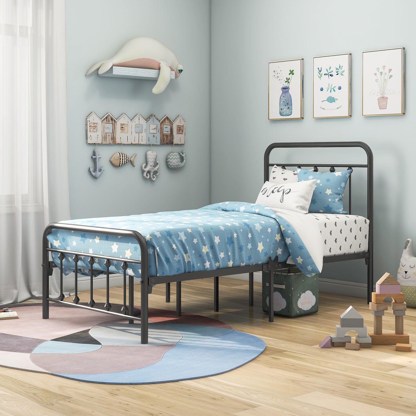 Dark grey metal twin bed frame with blue starpatterned bedding