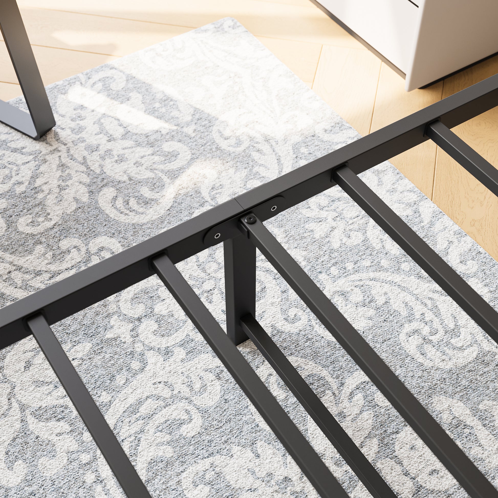 Black metal bed frame with sturdy slats and central support legs