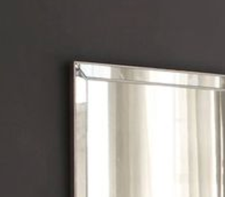 Frameless bevelled mirror with silver accents for modern bathrooms