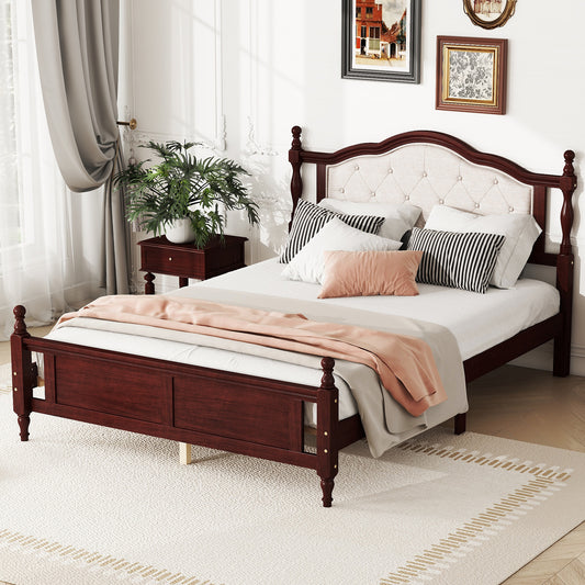 Dark cherry wood bed frame with tufted cream upholstered headboard and bedding