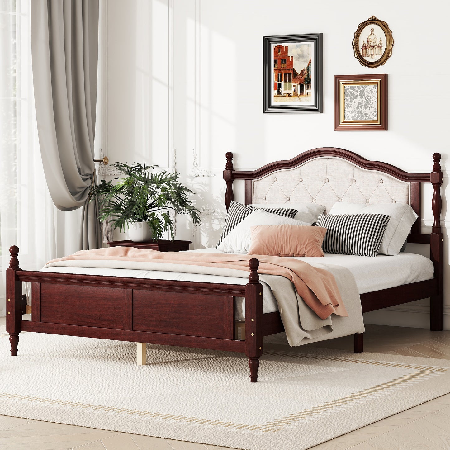 Dark cherry wood bed frame with tufted beige headboard and decorative finials