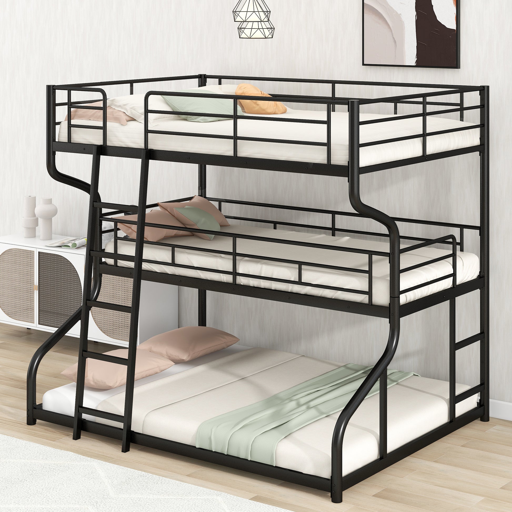 Black metal triple bunk bed with white mattresses and pillows