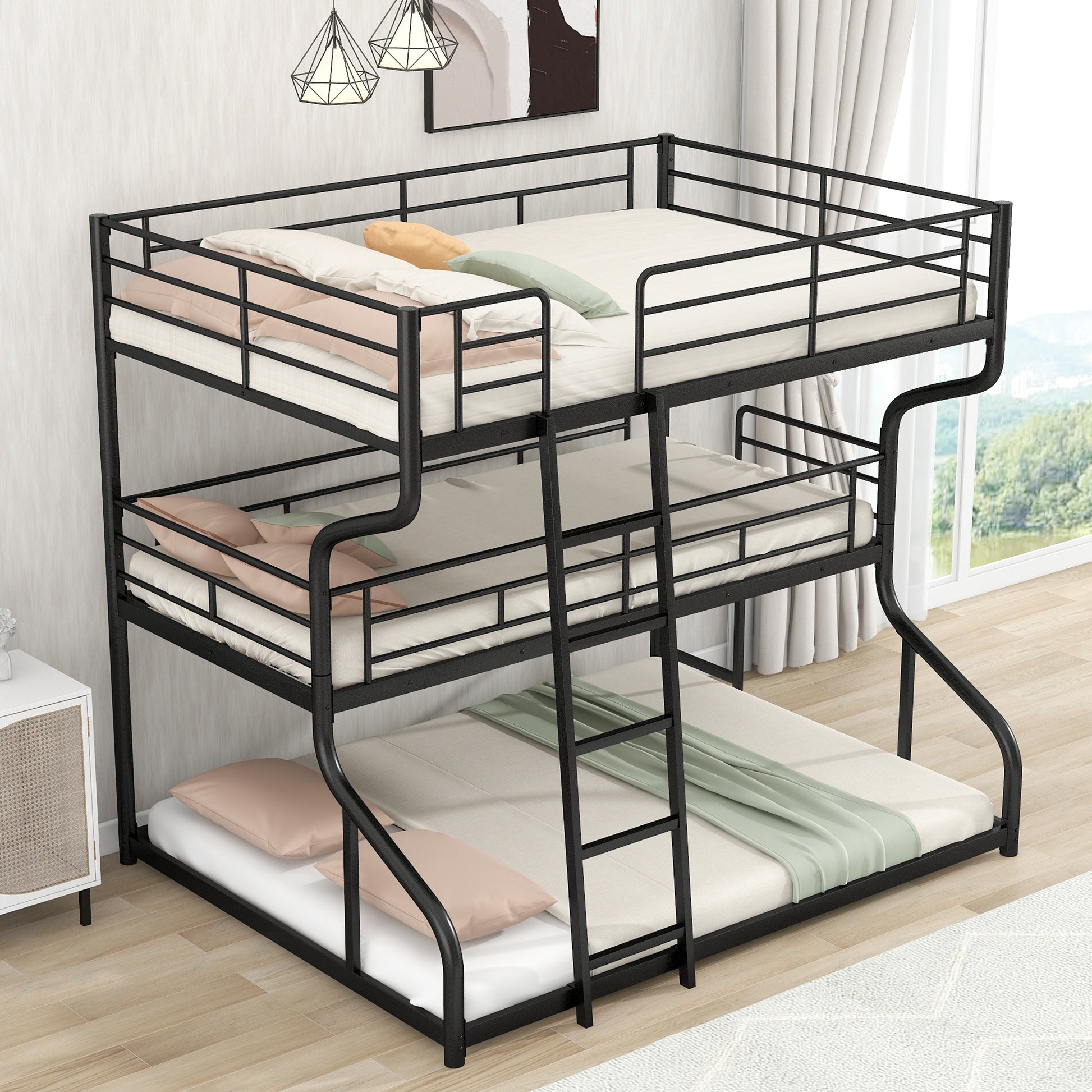 Black metal triple bunk bed with white mattresses and scattered pillows