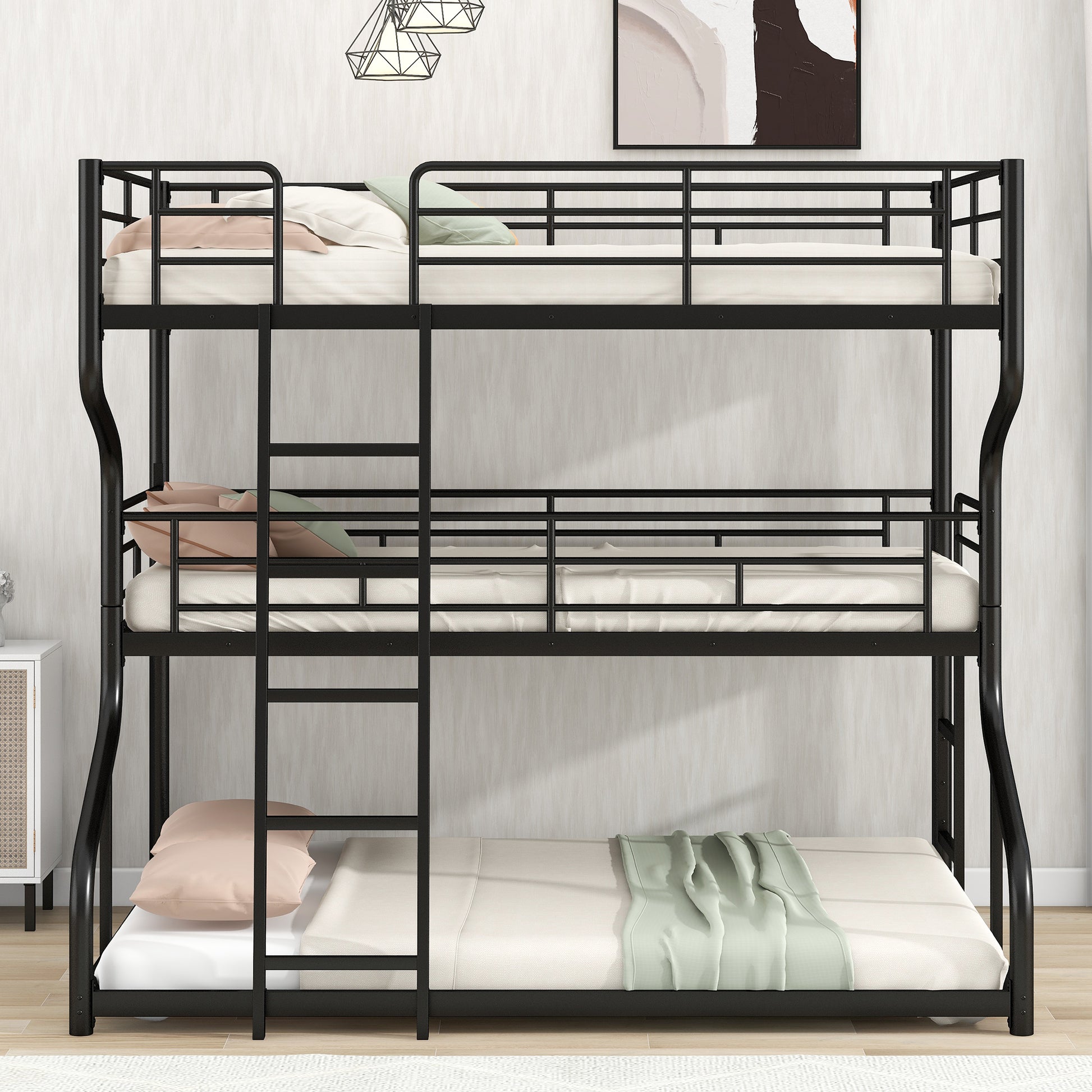 Black metal triple bunk bed with three white mattresses and accent pillows