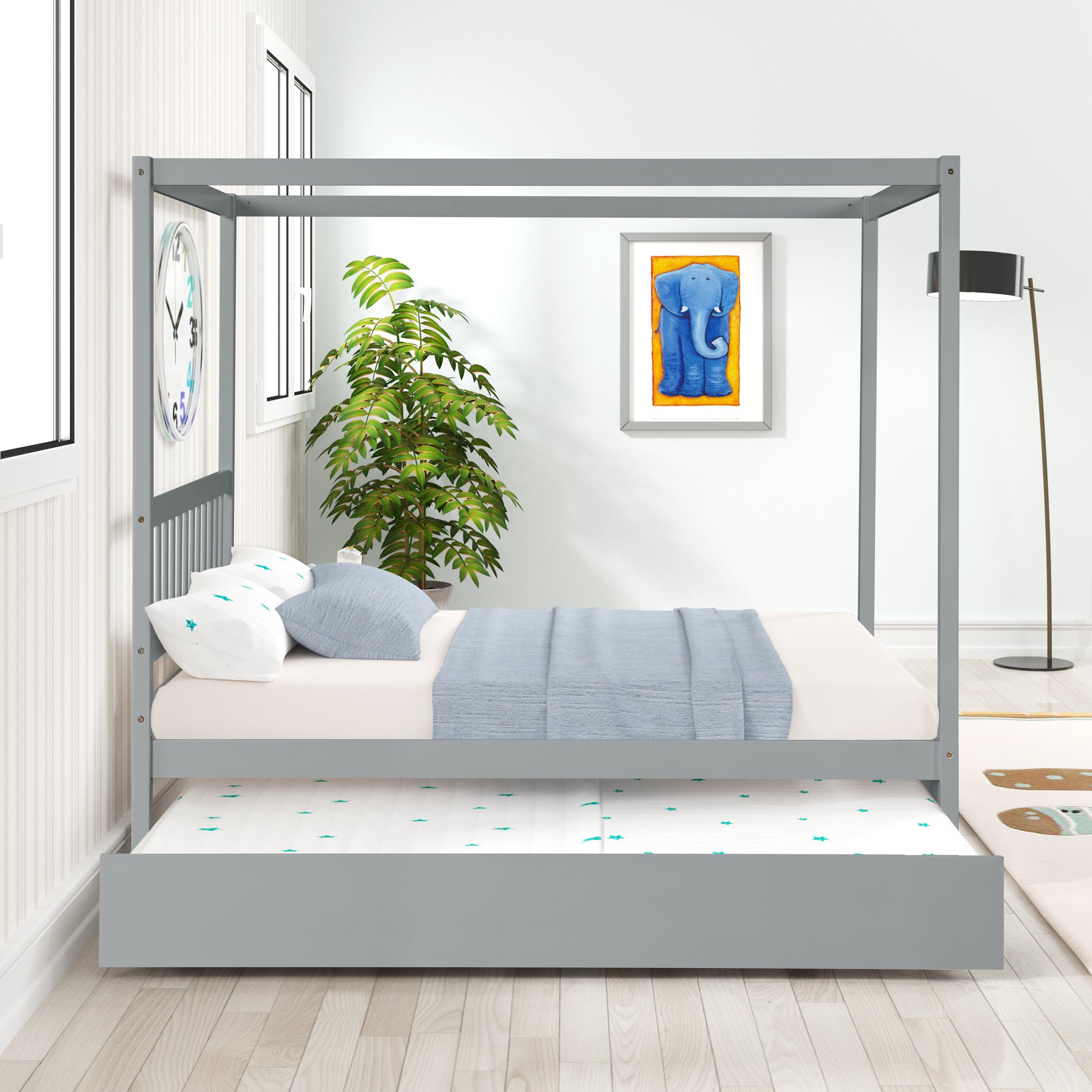 Gray canopy bed with pullout trundle and blue bedding perfect for kids rooms