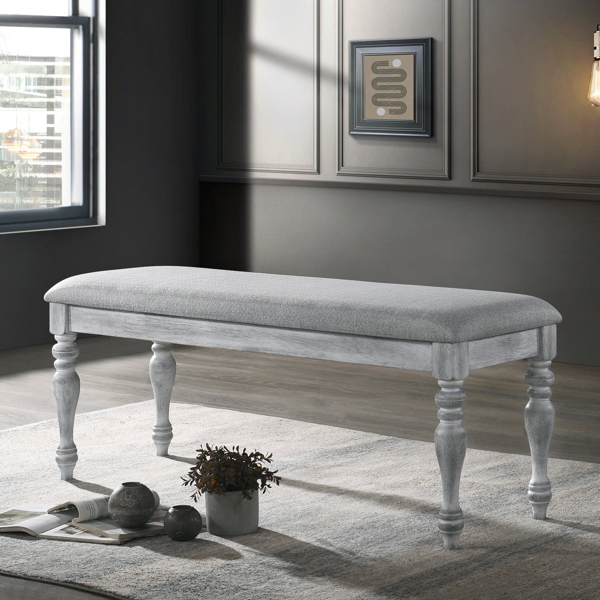 Grey upholstered bench with distressed white legs