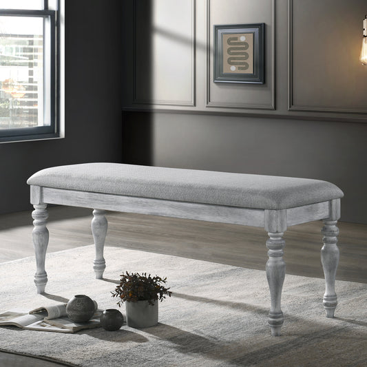 Grey upholstered bench with distressed white legs