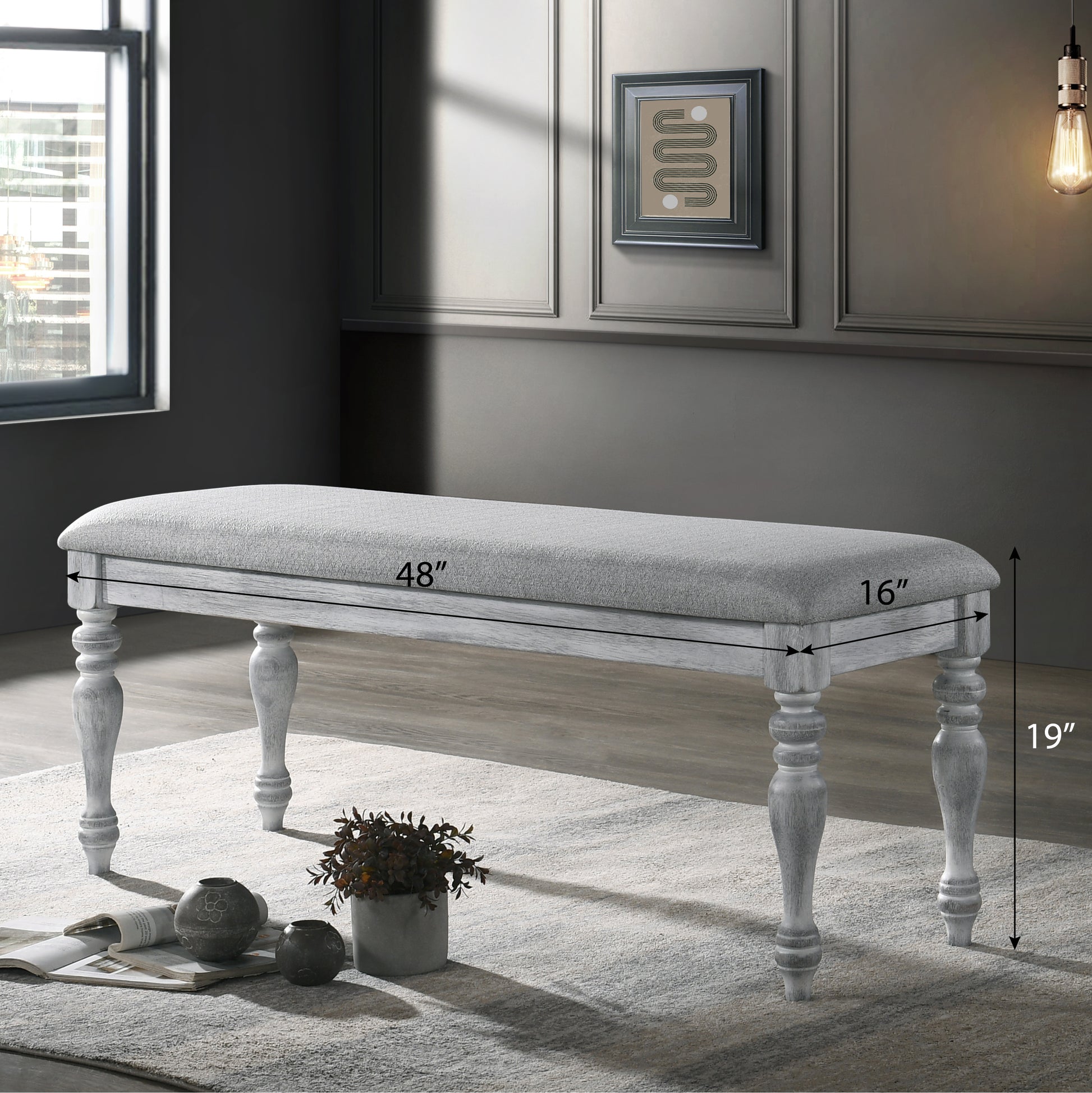 Grey upholstered storage bench with distressed wood legs