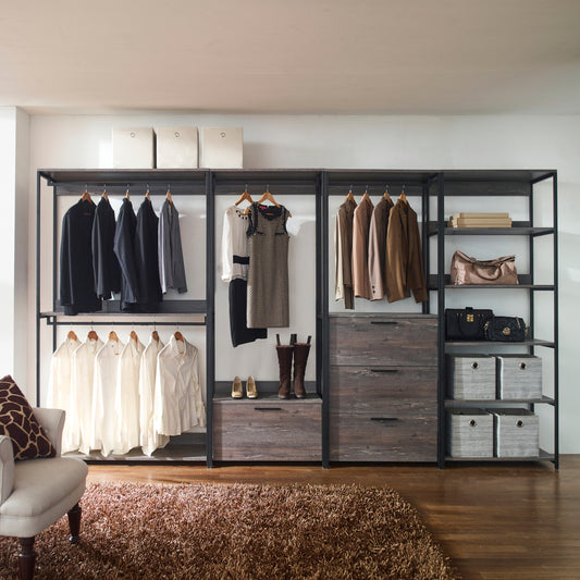 Black wool suits hanging on metal closet rack