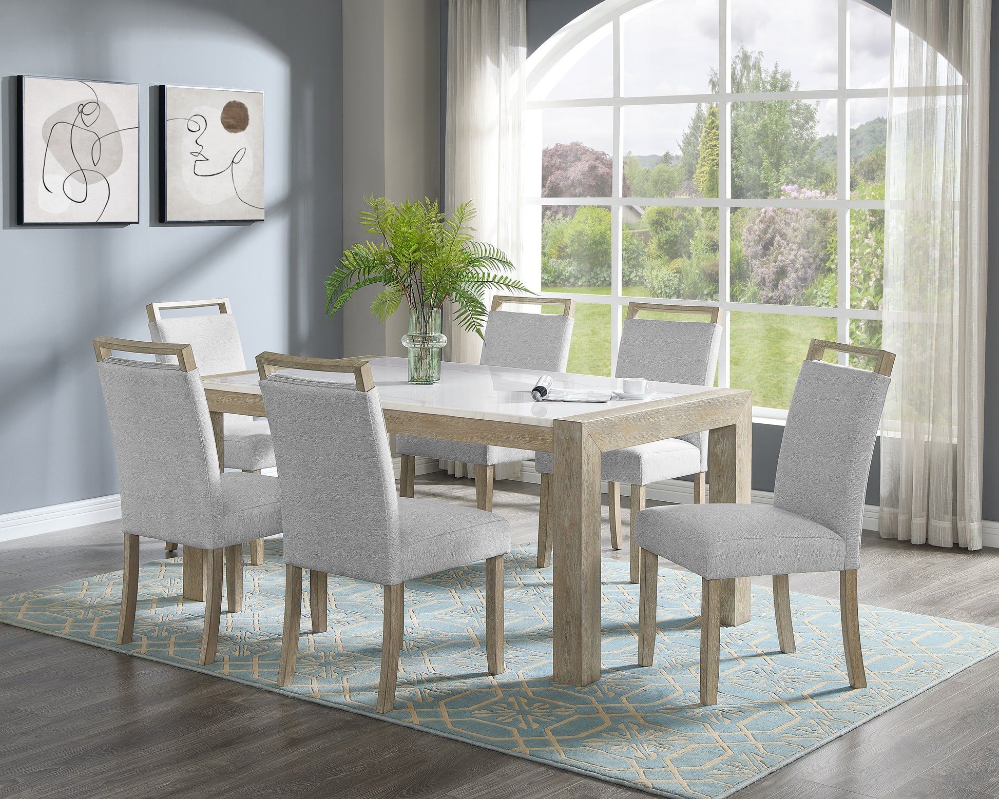 Modern white marble dining table with six grey upholstered chairs