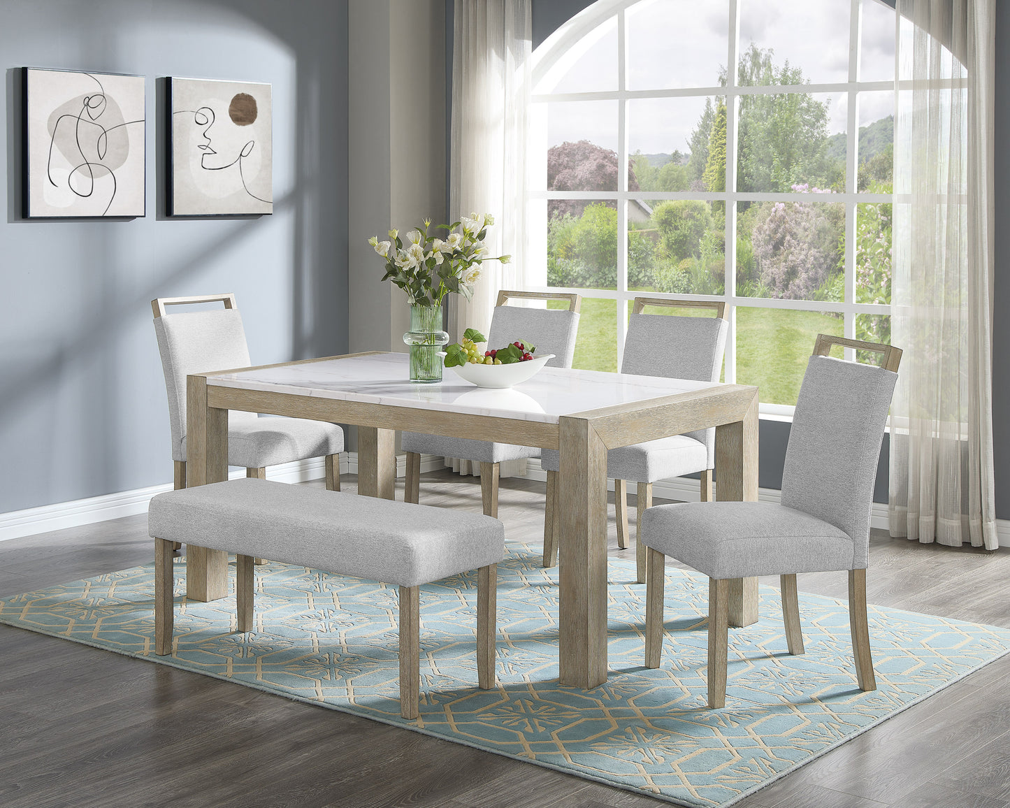Modern dining table set with marble top and grey upholstered chairs