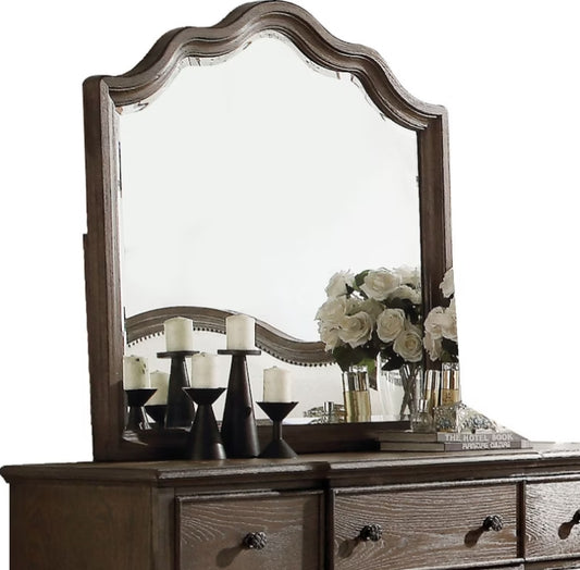 Ornate arched dresser mirror with distressed wood frame