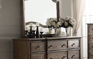 Rustic oak dresser with nine drawers and ornate mirror perfect for bedroom storage