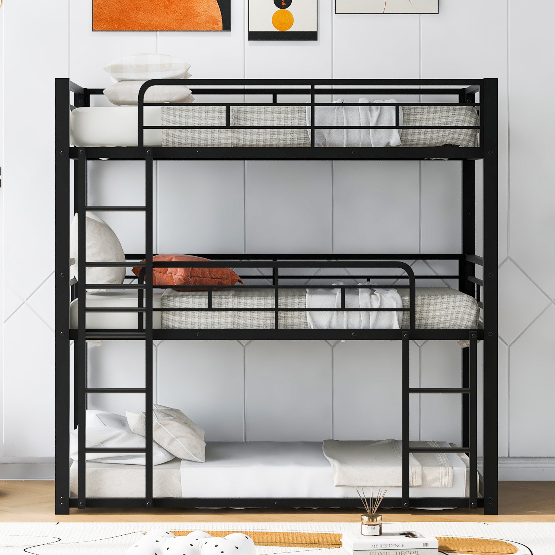 Black metal triple bunk bed with mattresses and pillows