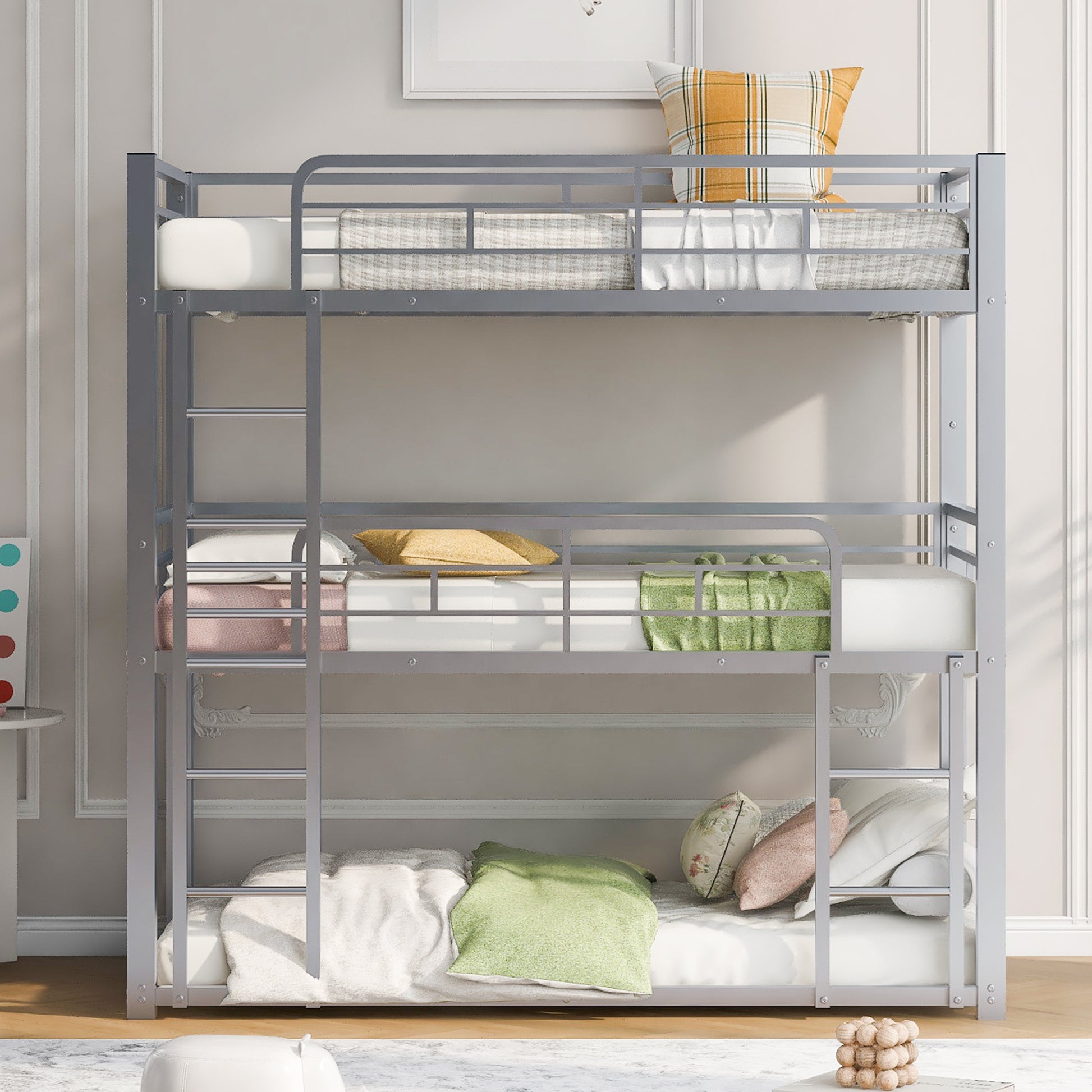 Silver metal triple bunk bed with mattresses and pillows